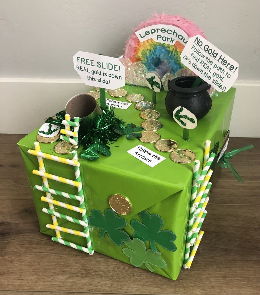 leprechaun trap ideas for kids using a green box with rainbow and gold coin path